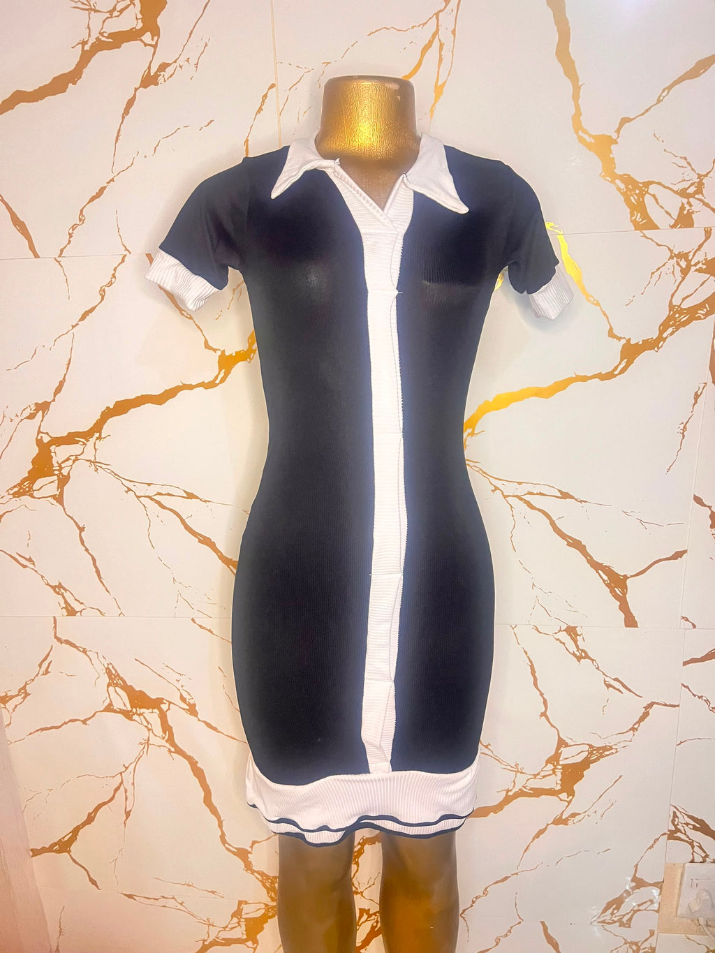 Black dress with white contrast trim, a white collar