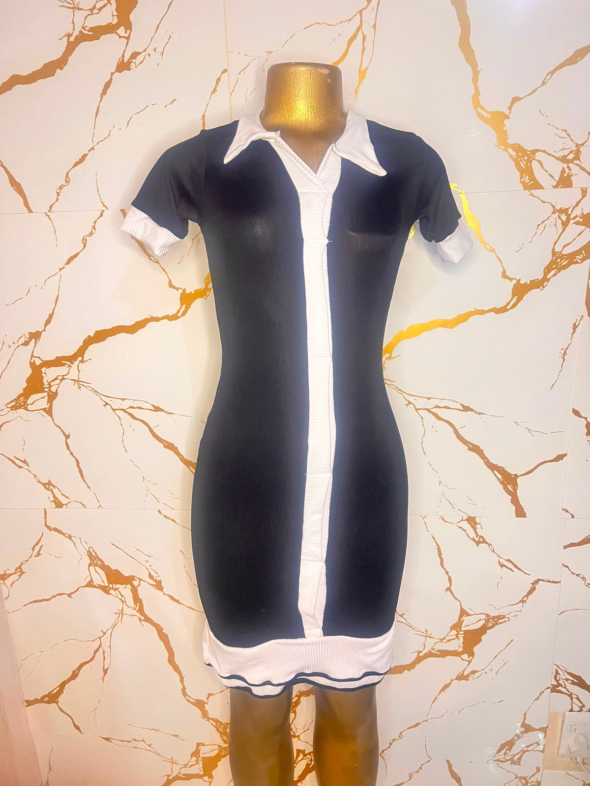 Black dress with white contrast trim, a white collar