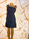 A black sleeveless ruffled mini dress 