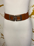 A brown wide belt with a large square buckle embellished with dark rhinestones