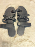 Black quilted leather ballet flats with metallic silver bow details on the toes