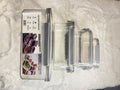 Set of three clear plastic storage containers with gray lids 