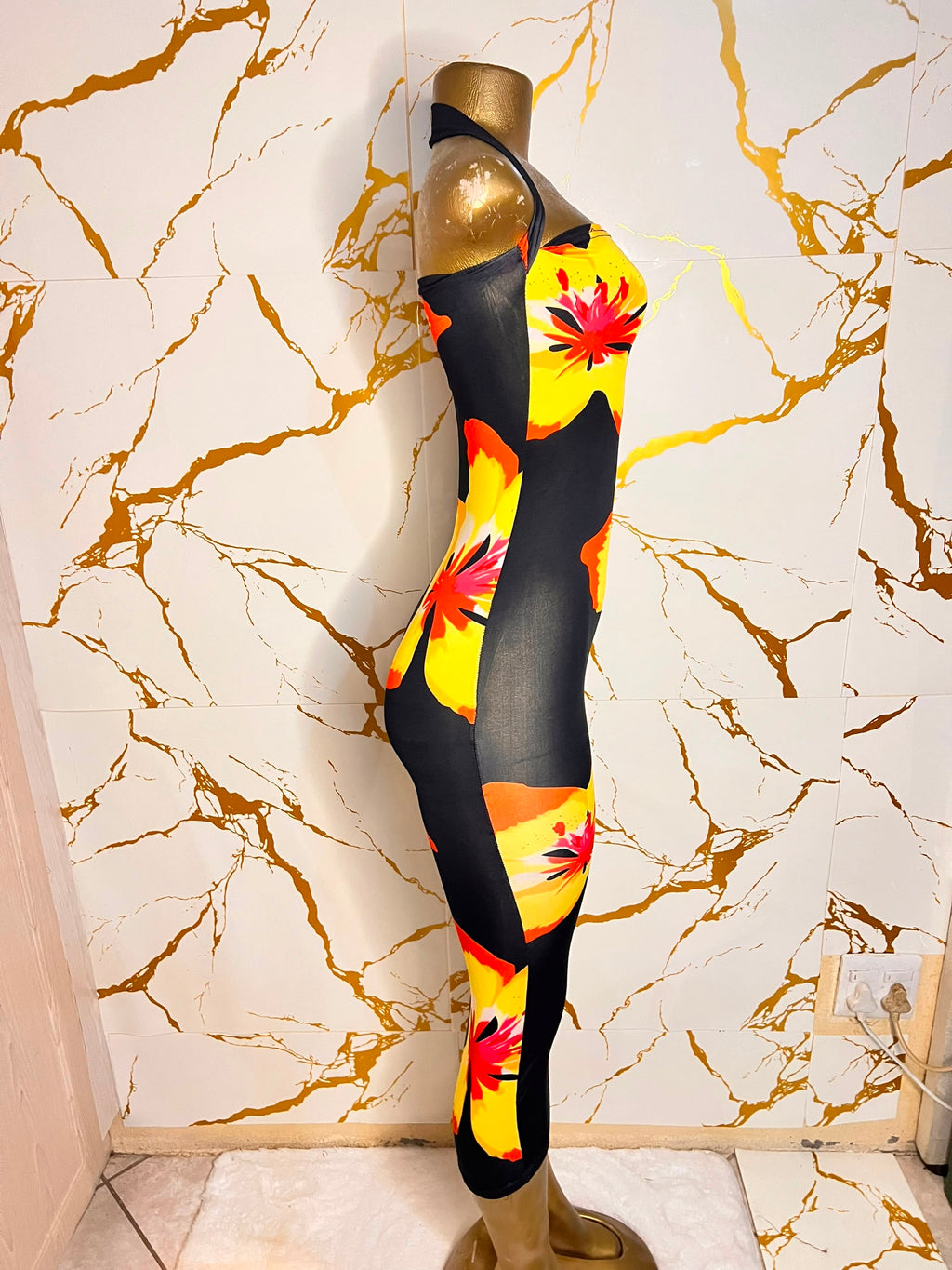 A black halter-neck bodycon dress