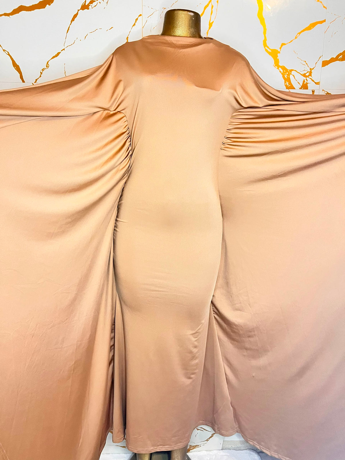 Peach satin dress,high neck, fitted silhouette, and draped side panels