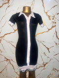 A short-sleeve black dress with white contrast trim, a white collar