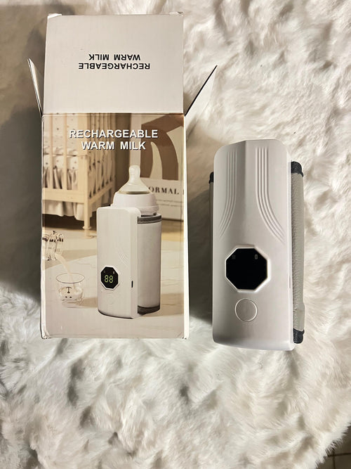 A white rechargeable warm milk bottle