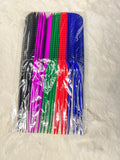 A set of six hair combs in assorted colors including black, pink, green, 