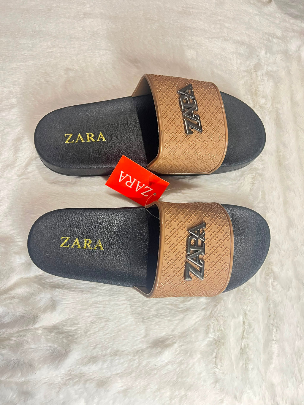Zara slide sandals with black footbeds and textured tan straps
