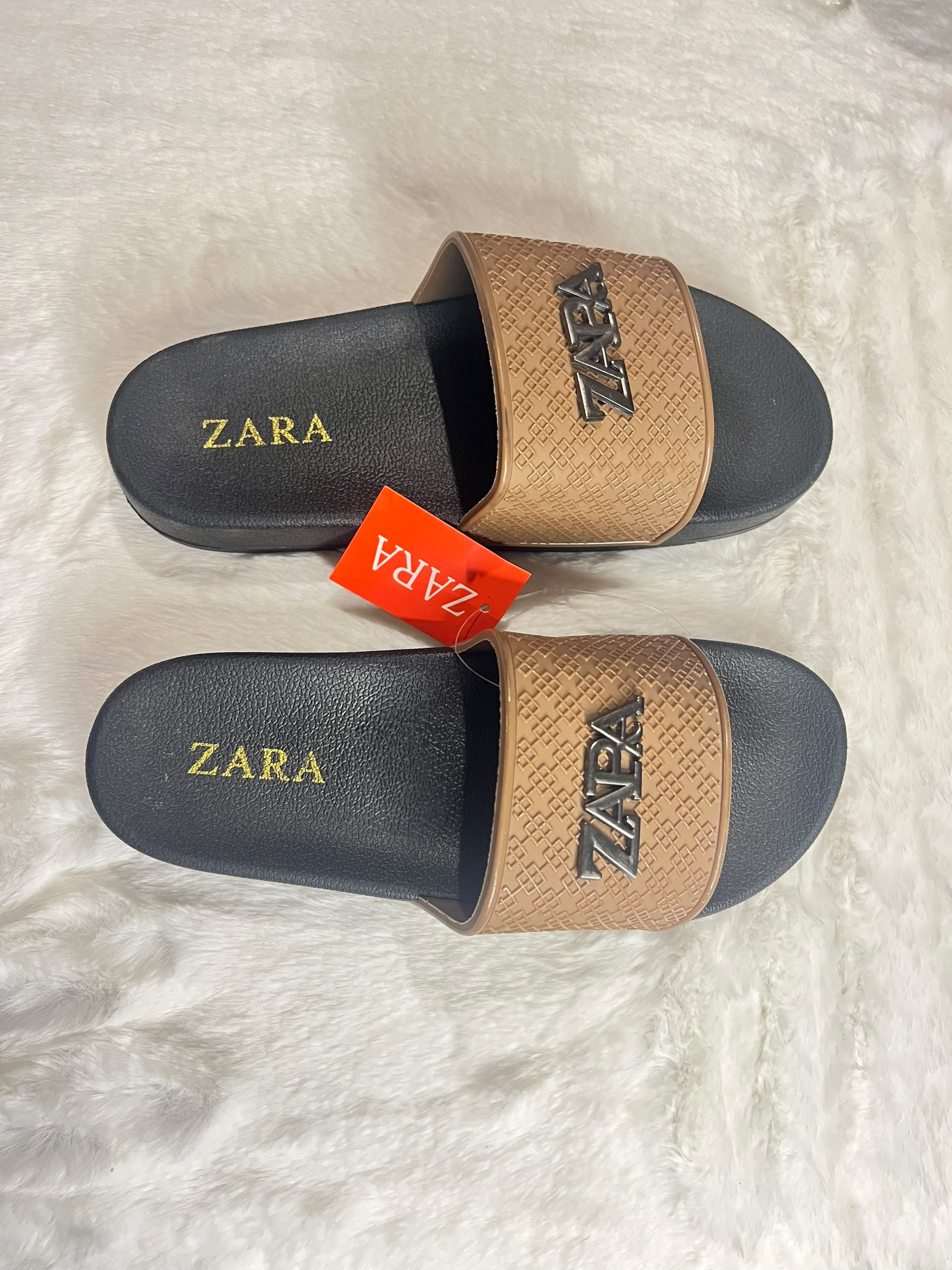 Zara slide sandals with black footbeds and textured tan straps
