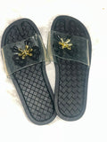 black woven-texture slide sandals with clear plastic straps