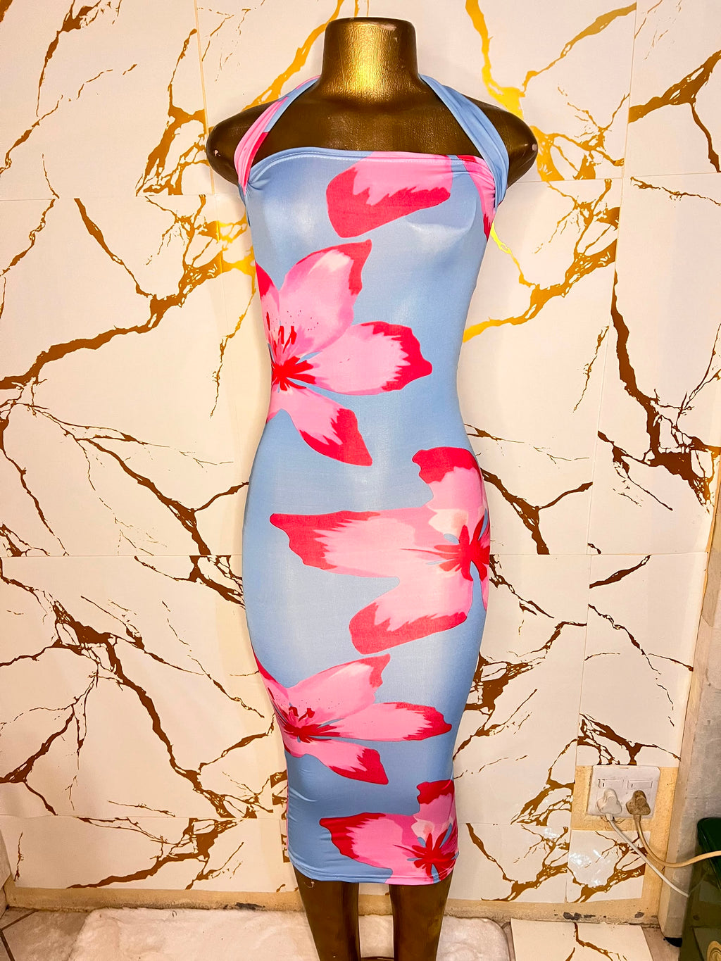 A sleeveless halter-neck bodycon dress