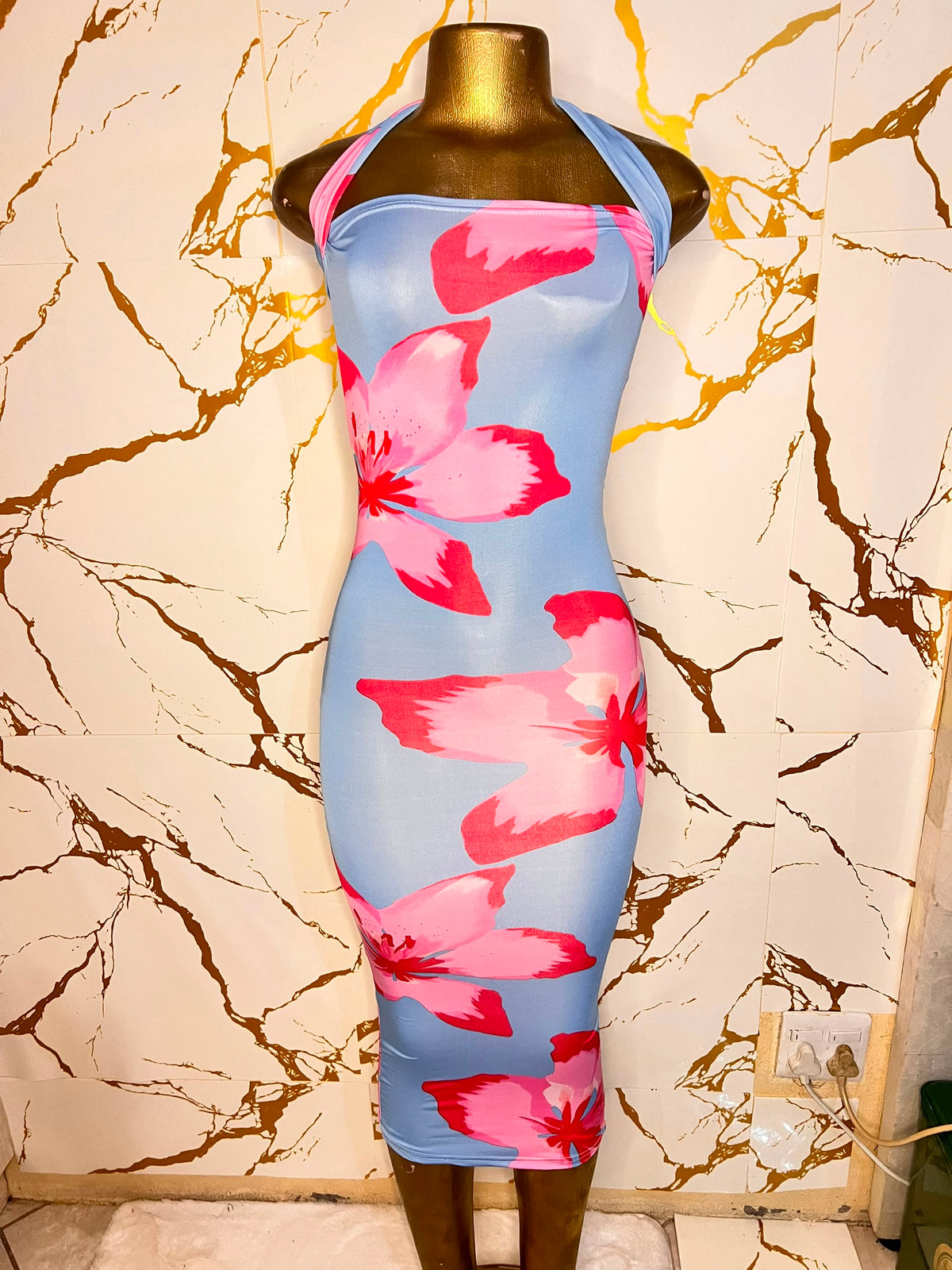 A sleeveless halter-neck bodycon dress