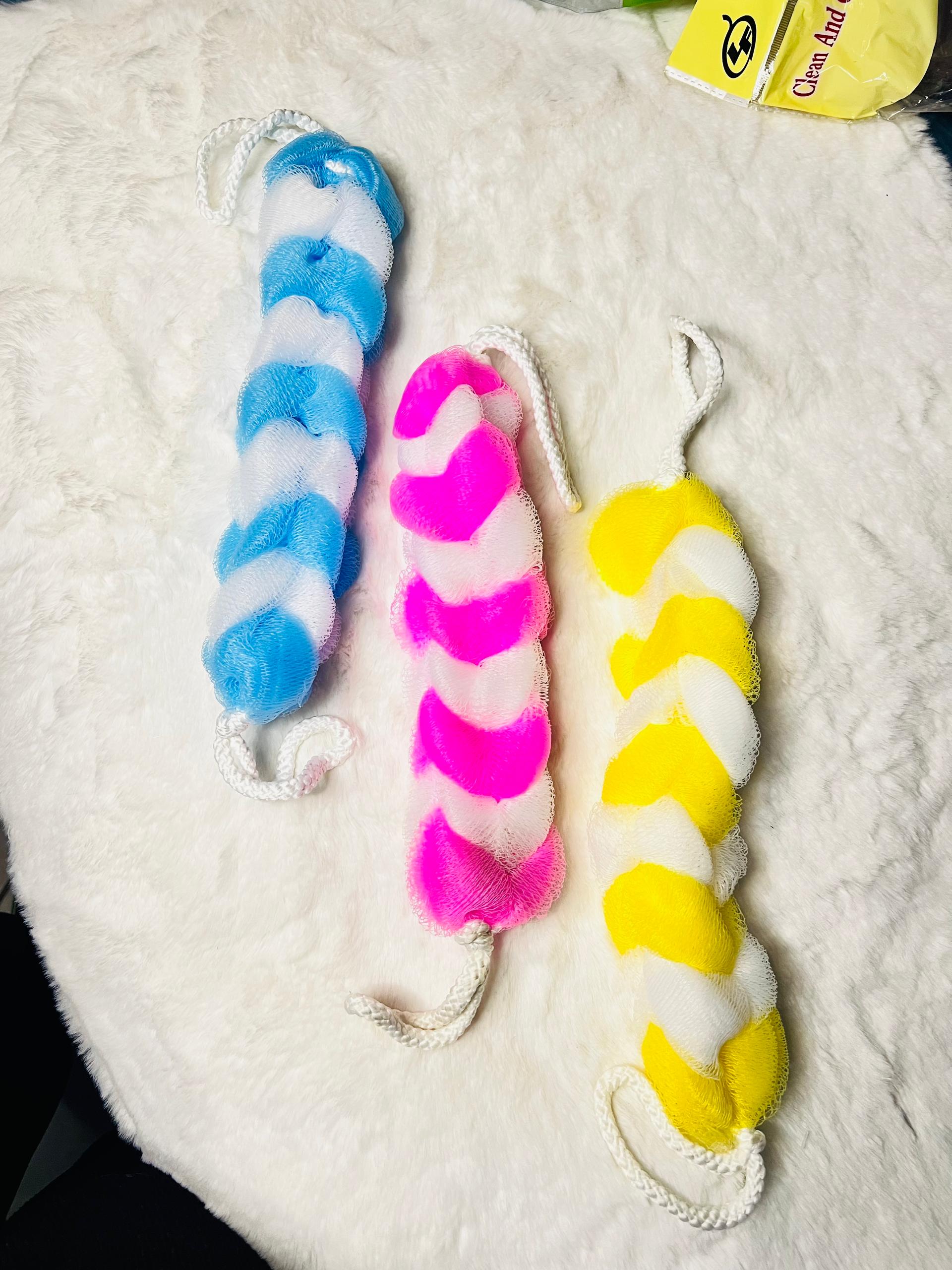 Three twisted faux-fur bath scrubbers