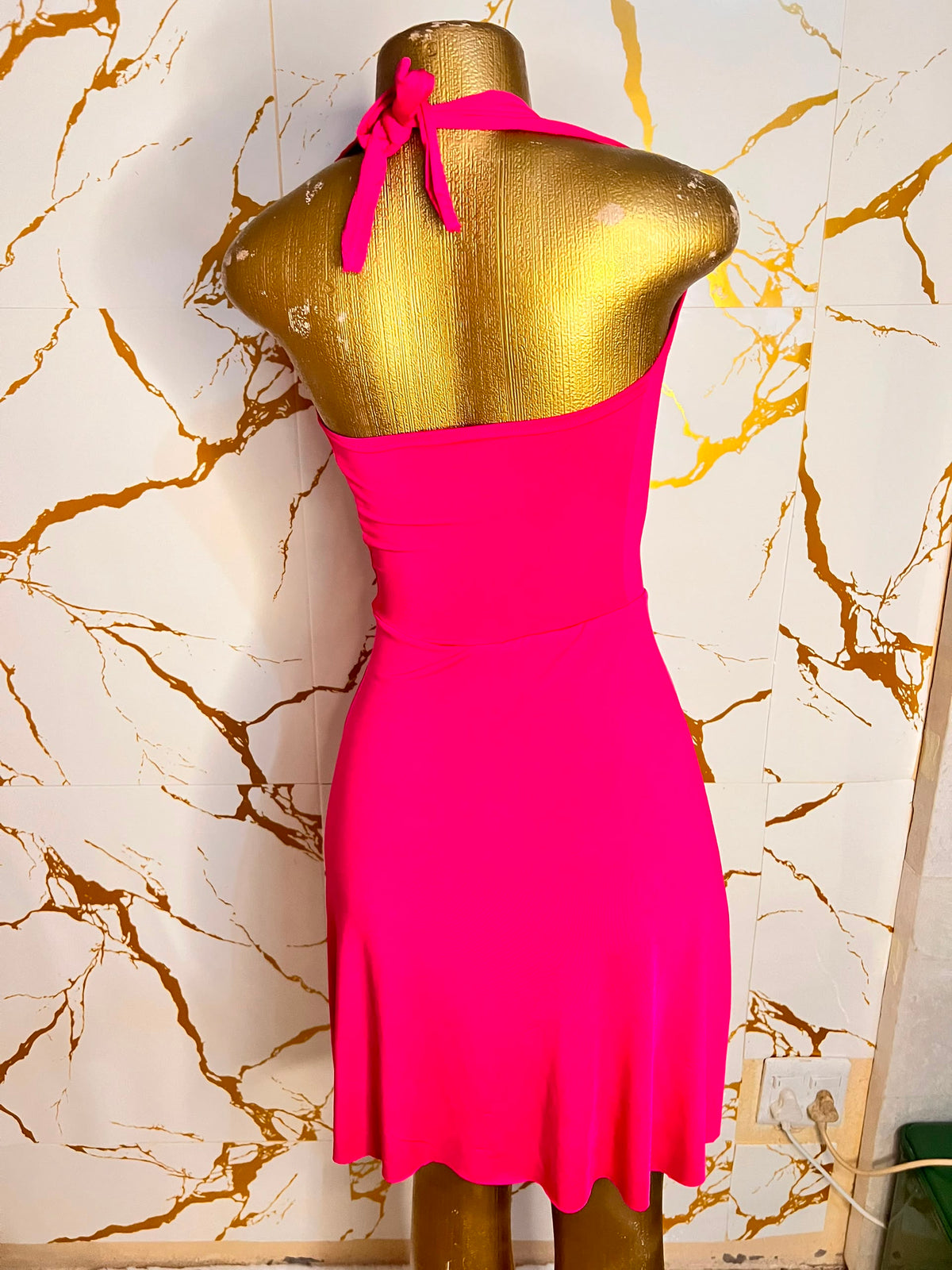A bright pink sleeveless dress