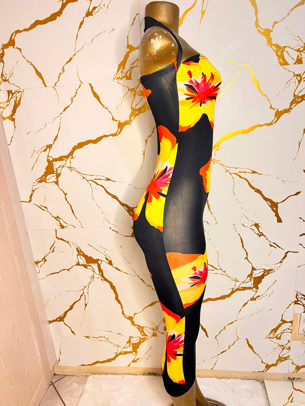 A black halter-neck bodycon dress