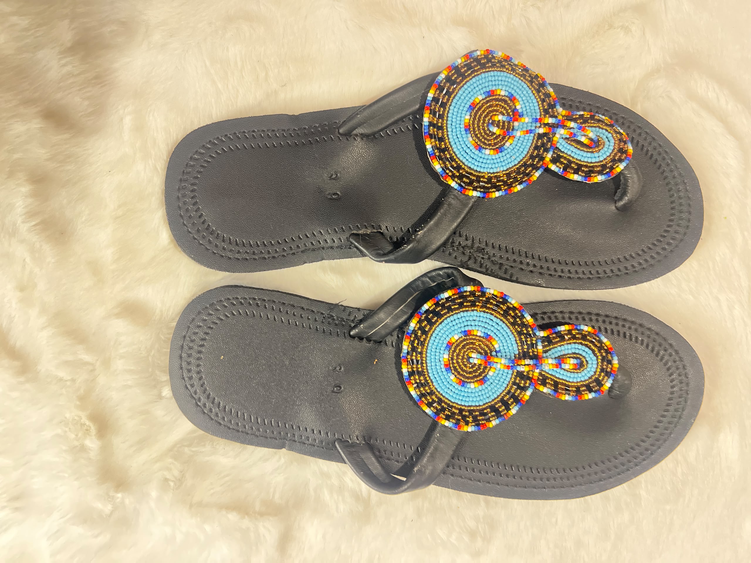 thong sandals with intricate hand-beaded straps