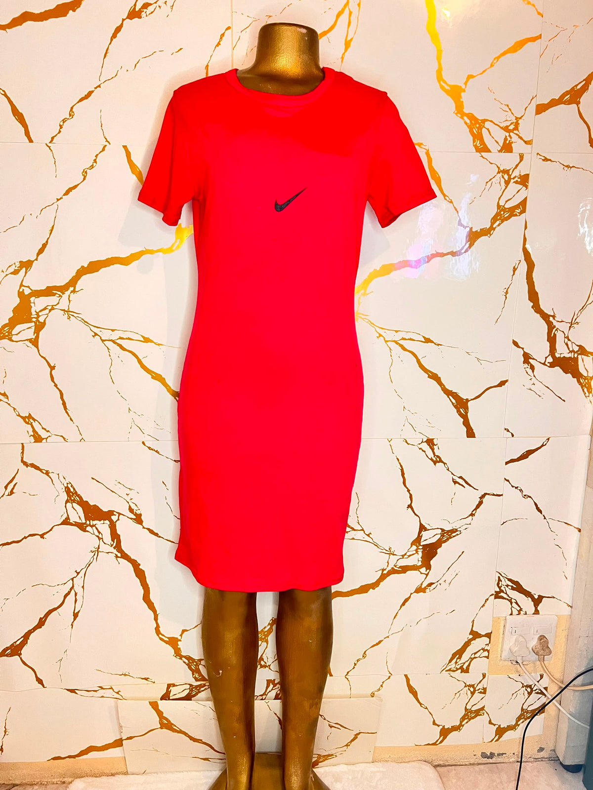 A bright red short-sleeve Nike dress 