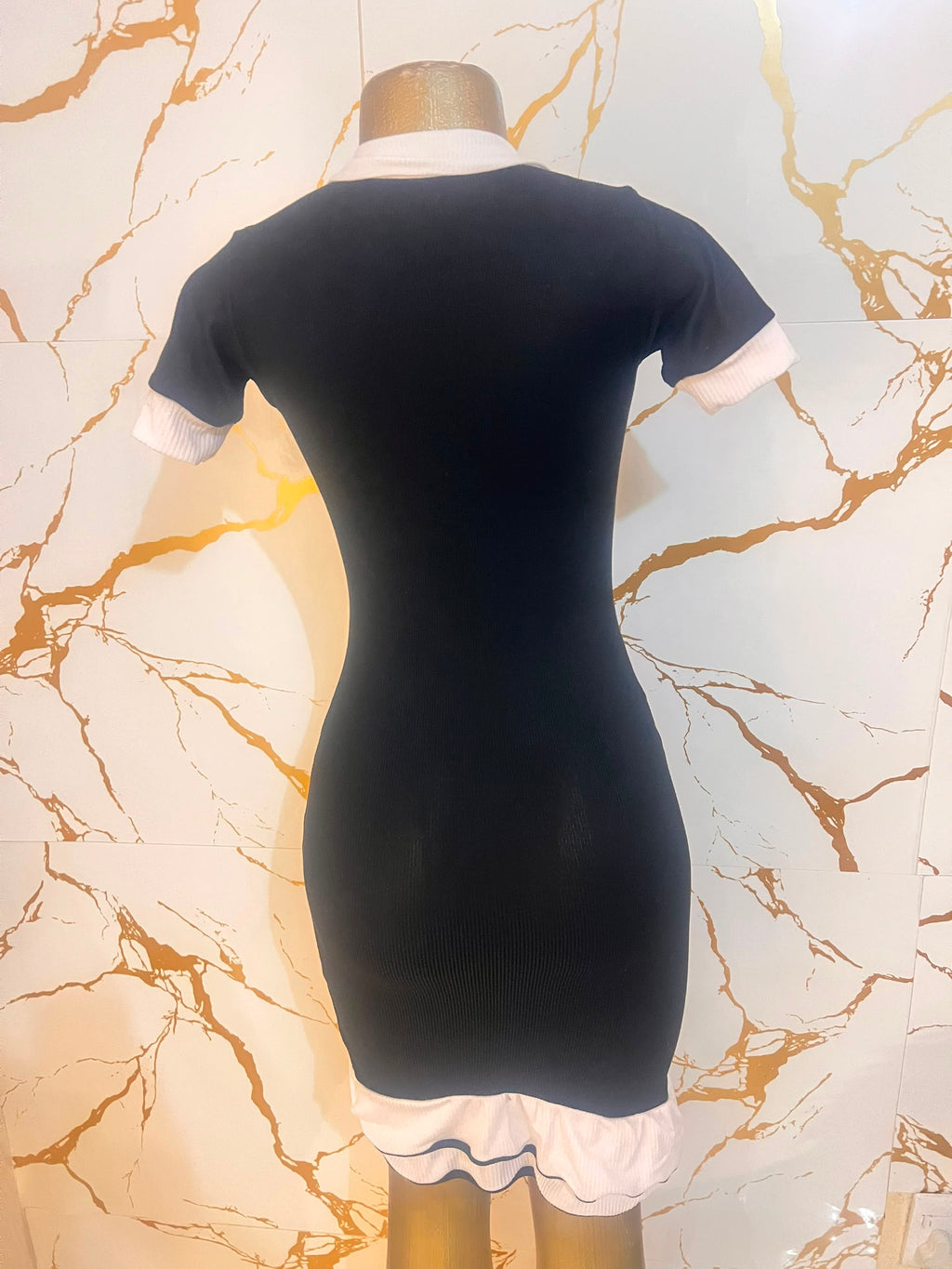 Black dress with white contrast trim, a white collar
