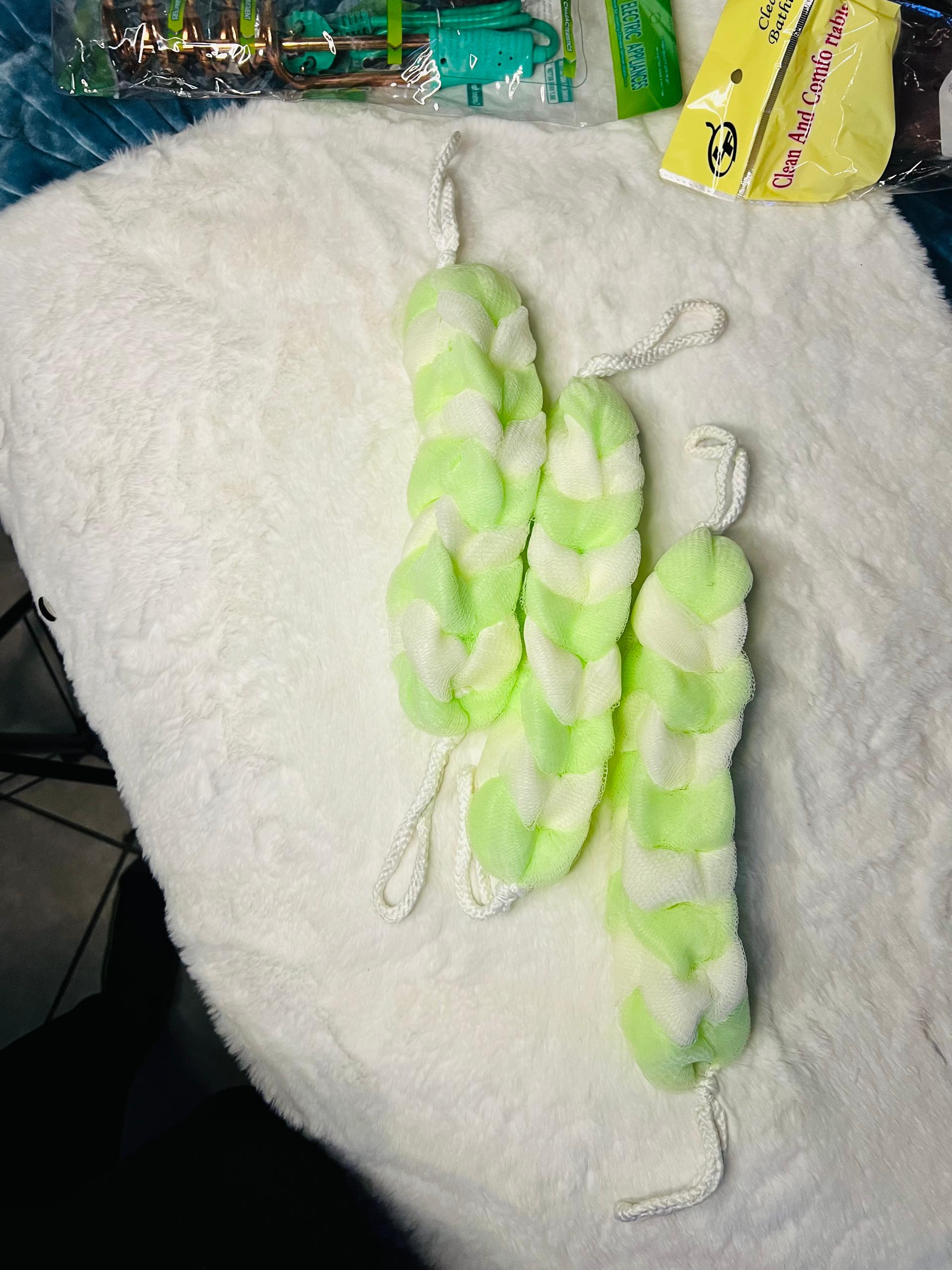 Three twisted faux-fur bath scrubbers