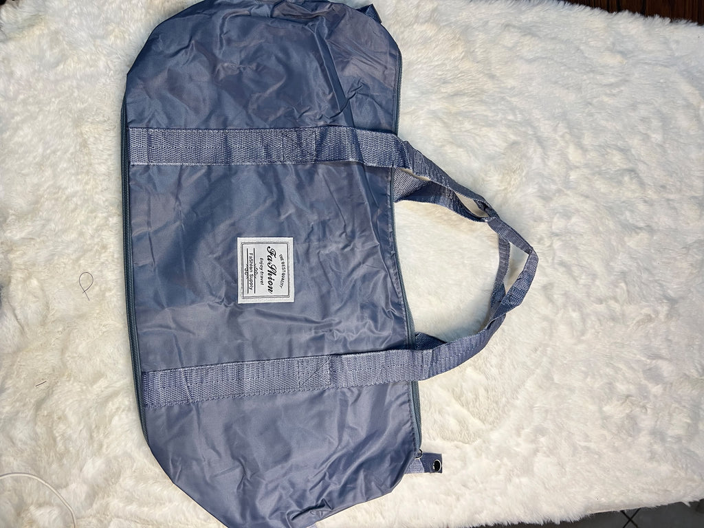 Blue travelling zippered duffel bag with dual shoulder straps