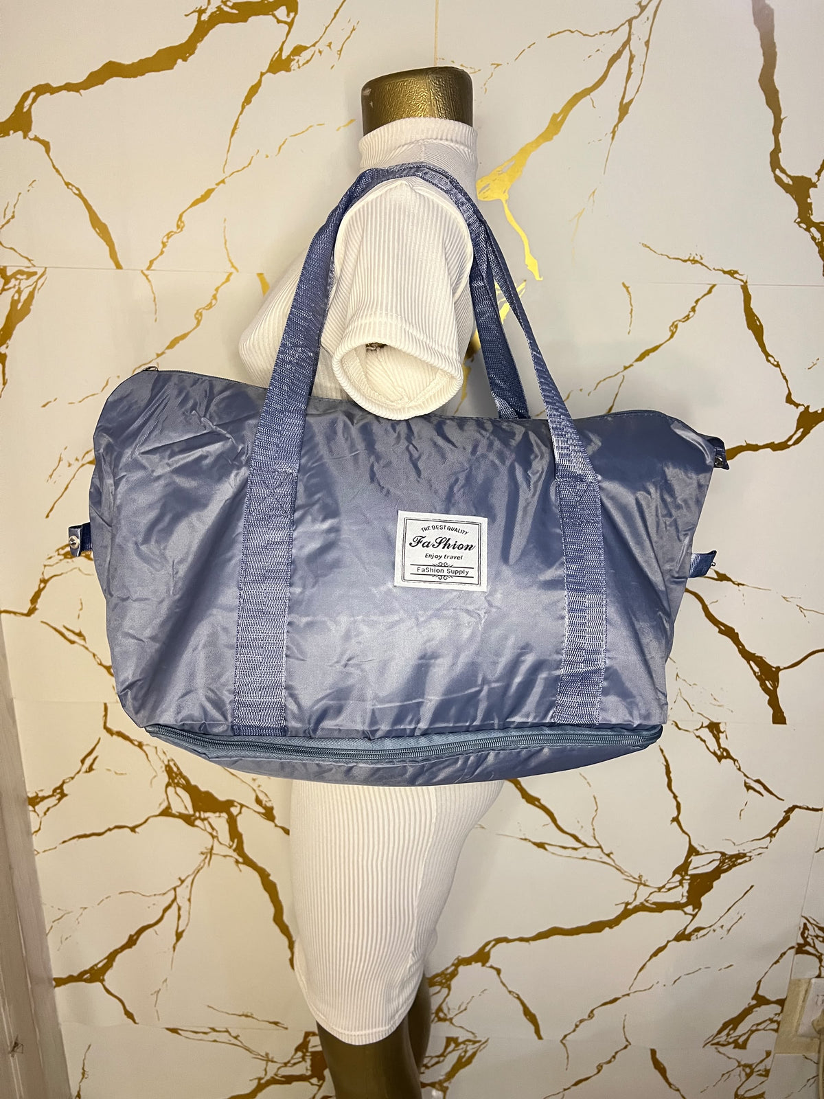  Blue travelling zippered duffel bag with dual shoulder straps
