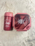 A pink lunch box set with a matching insulated cup