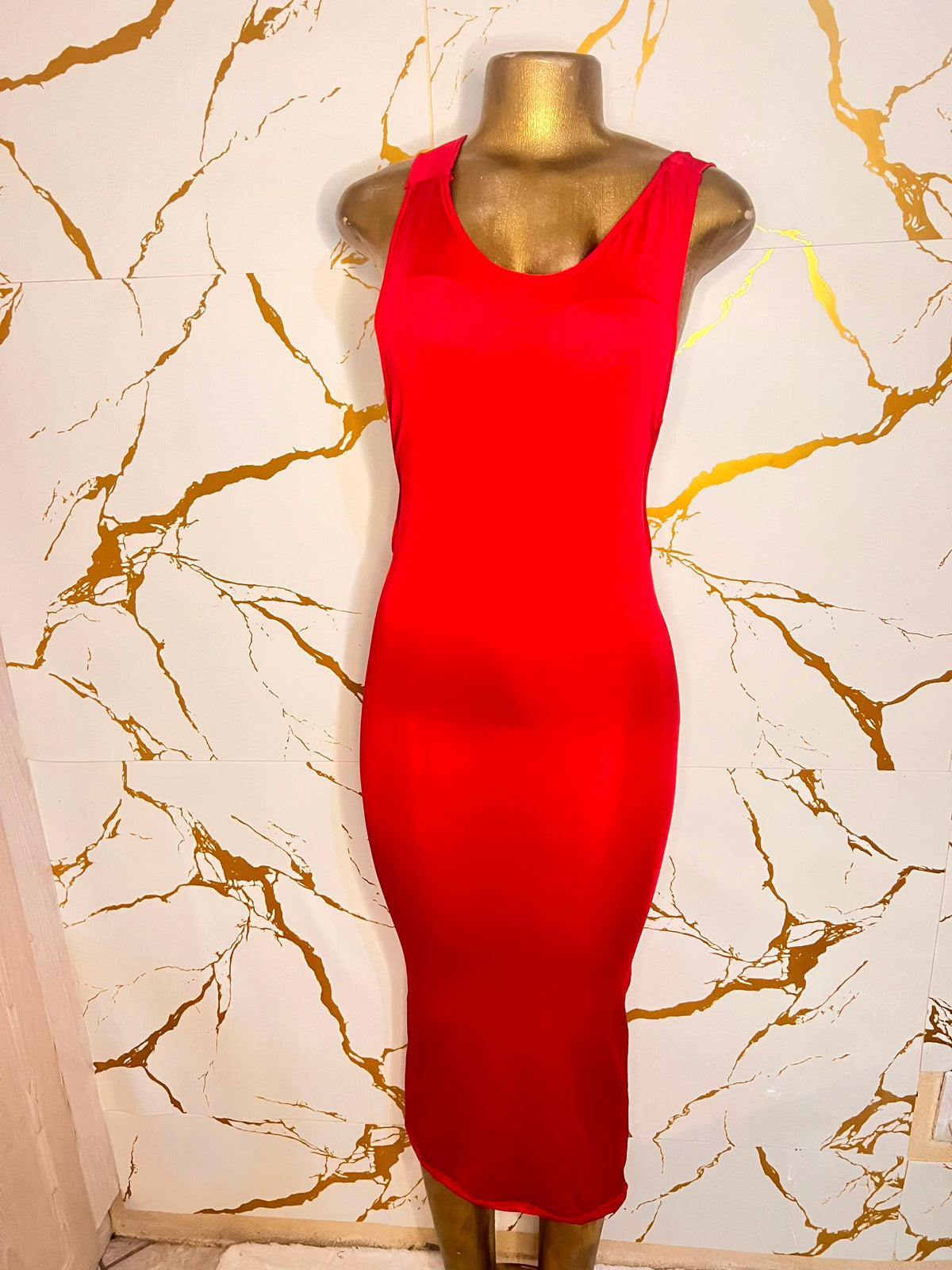 A bright red sleeveless bodycon dress 