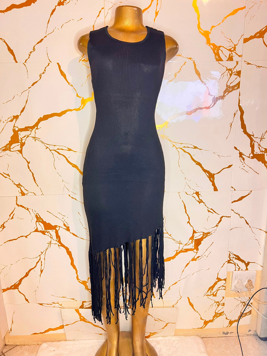 A sleeveless ribbed knit bodycon dress in black