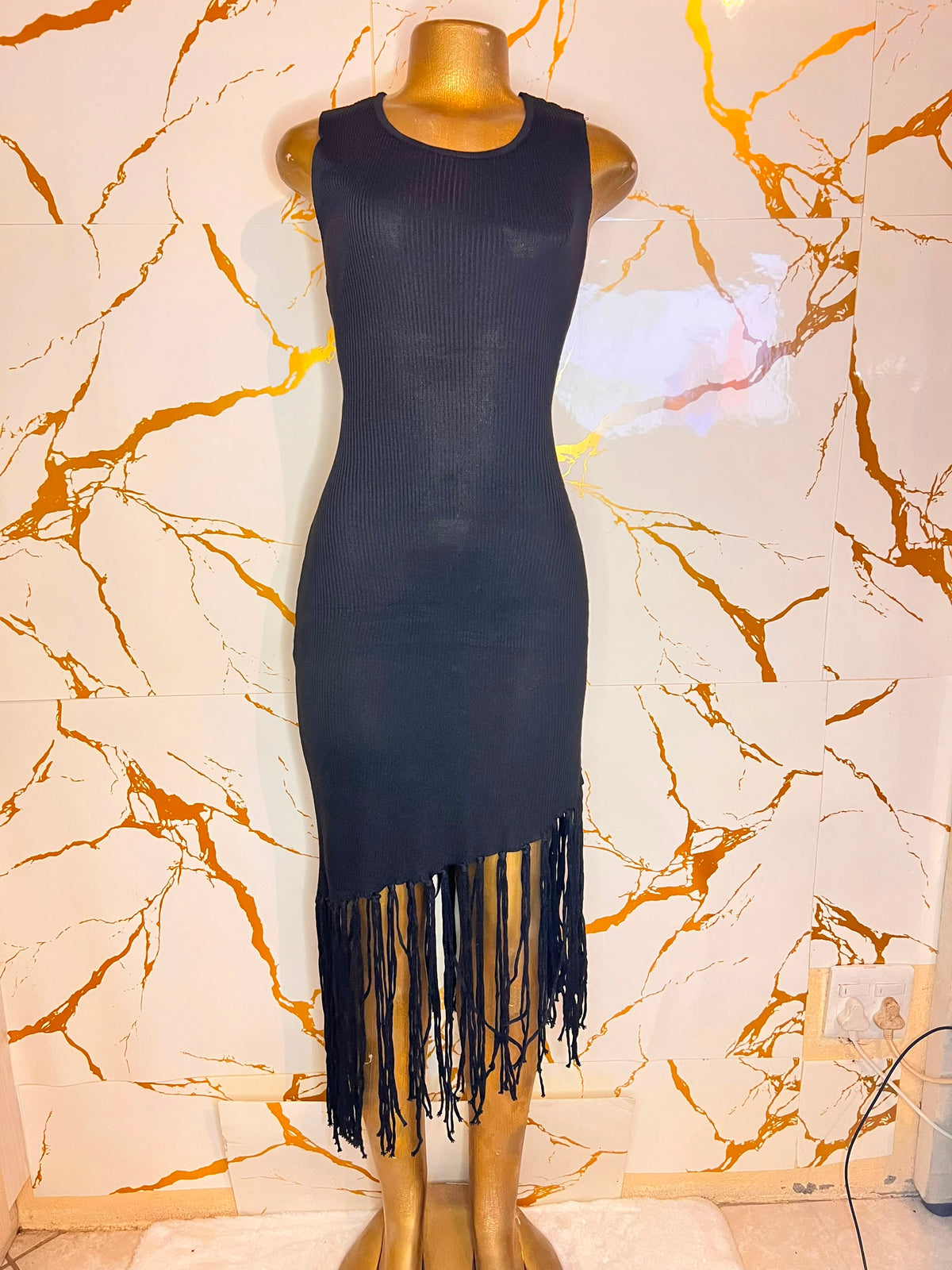 A sleeveless ribbed knit bodycon dress in black