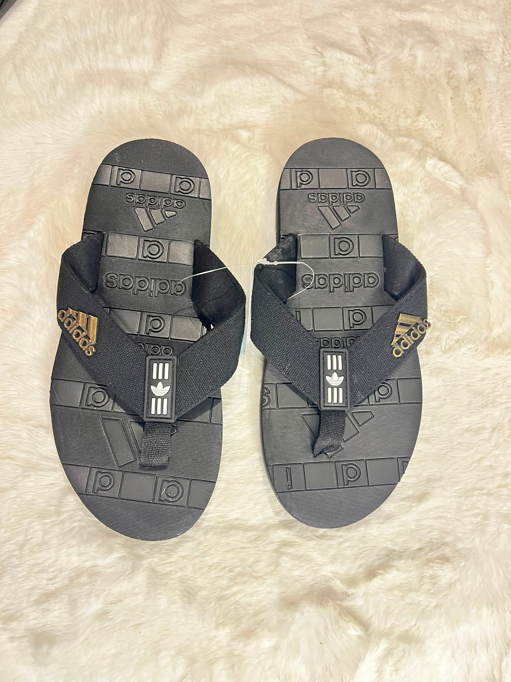 Adidas flip-flops in dark gray and black