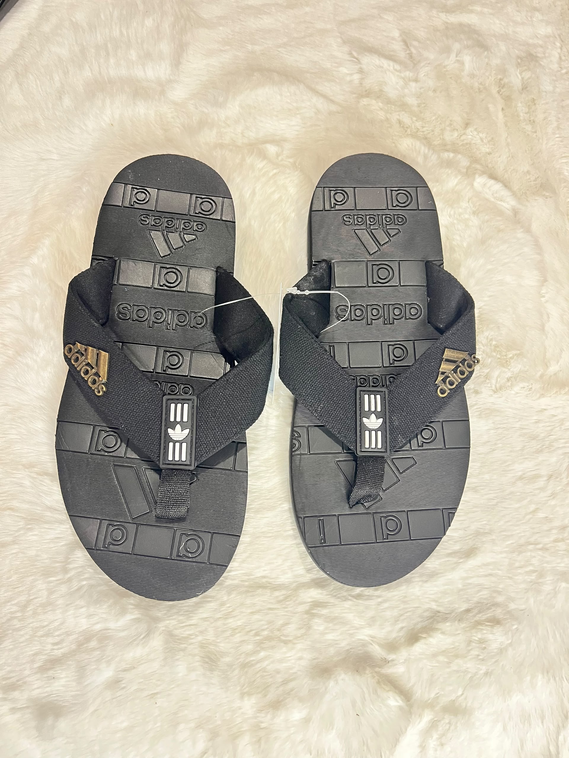 Adidas flip-flops in dark gray and black