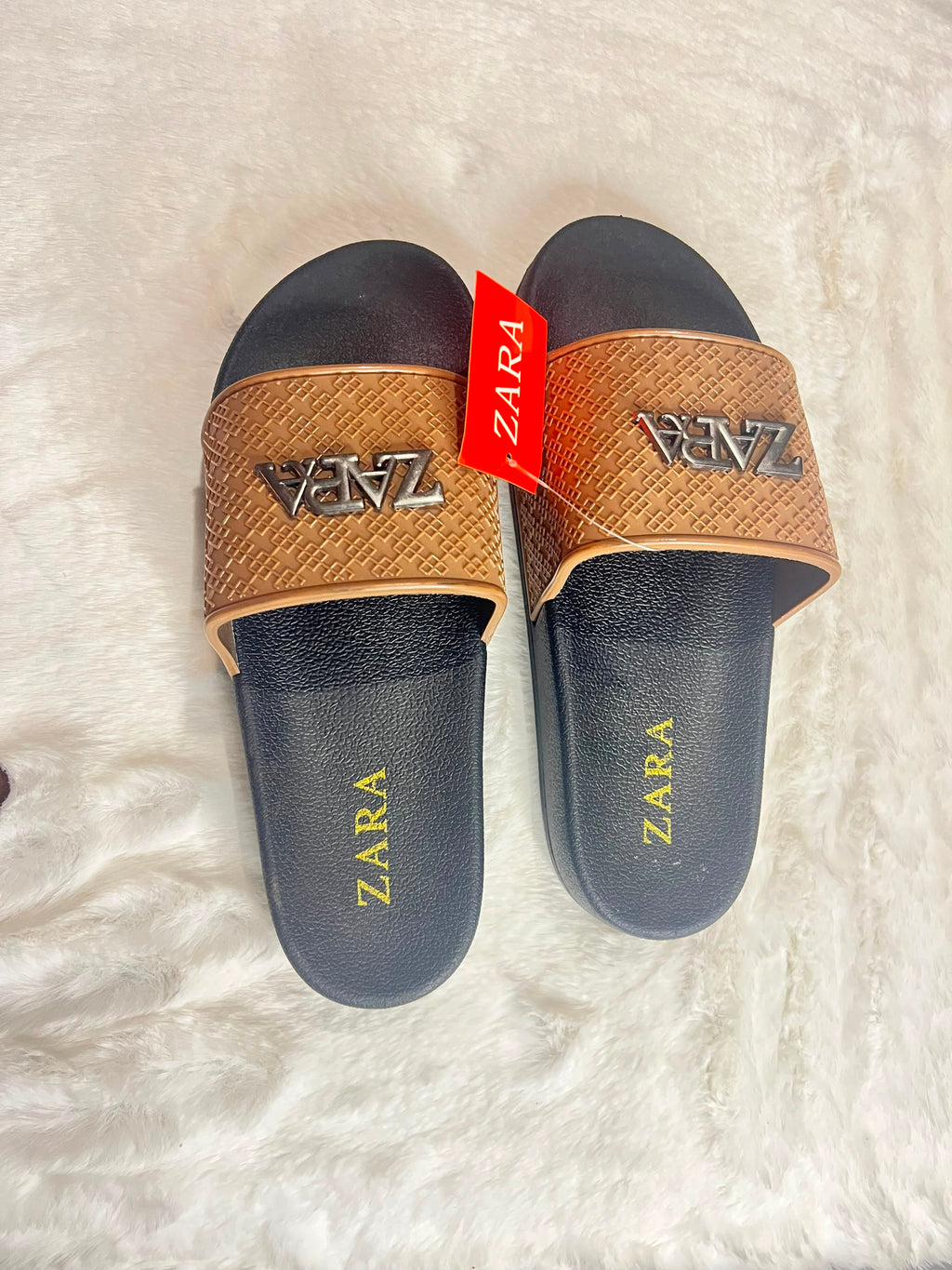 Zara slide sandals with black footbeds and textured tan straps