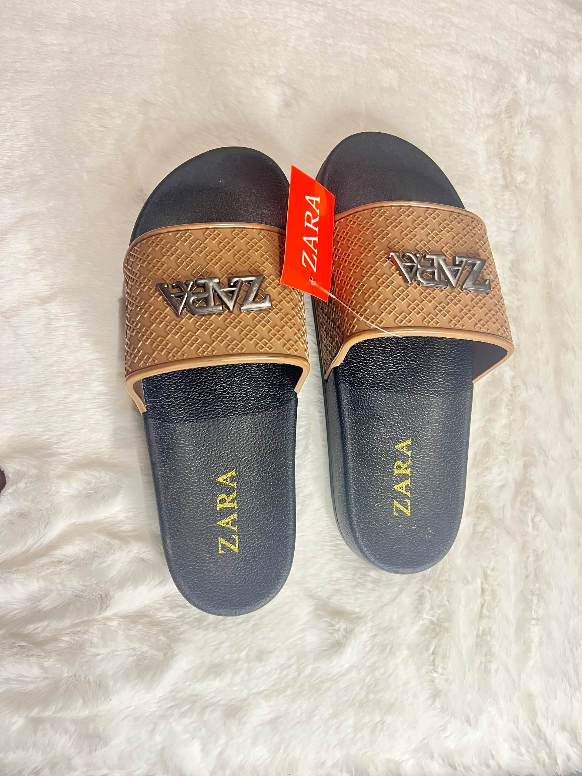 Zara slide sandals with black footbeds and textured tan straps