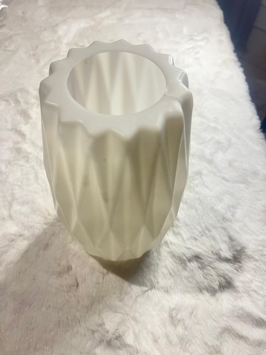 White ceramic vase with a textured, faceted diamond
