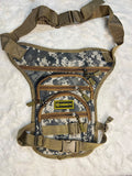 A tactical chest rig bag in digital camouflage pattern with tan webbing straps