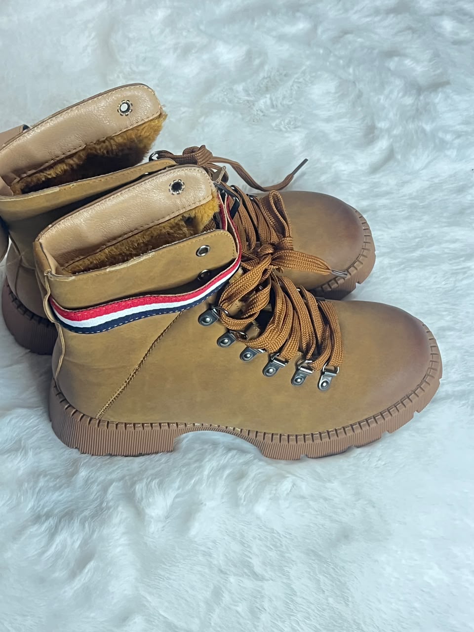 brown suede lace-up ankle boot with a thick lug sol