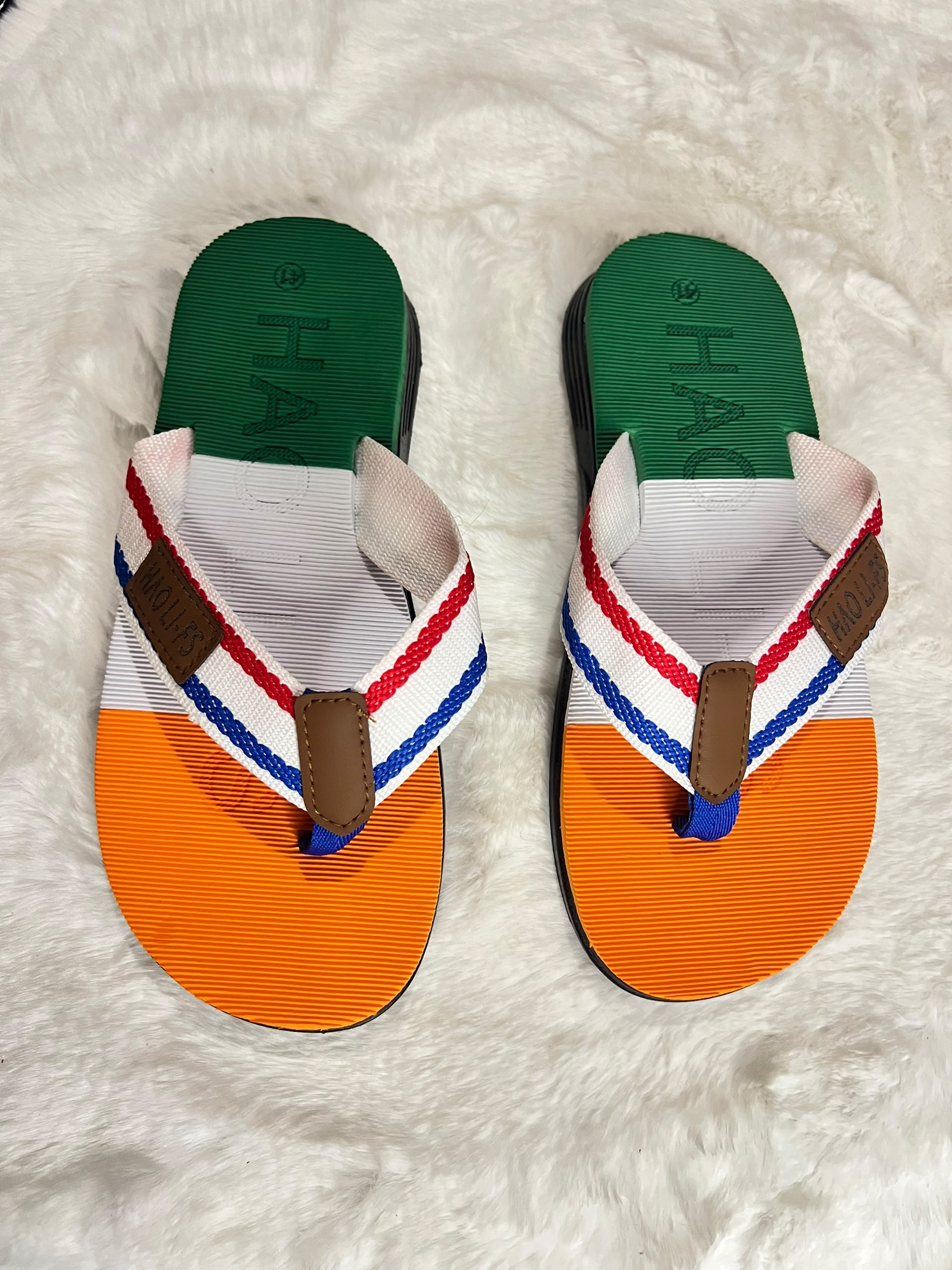 Hágás flip-flop sandals with a green, white, and orange