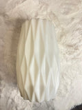 White ceramic vase with a textured, faceted diamond