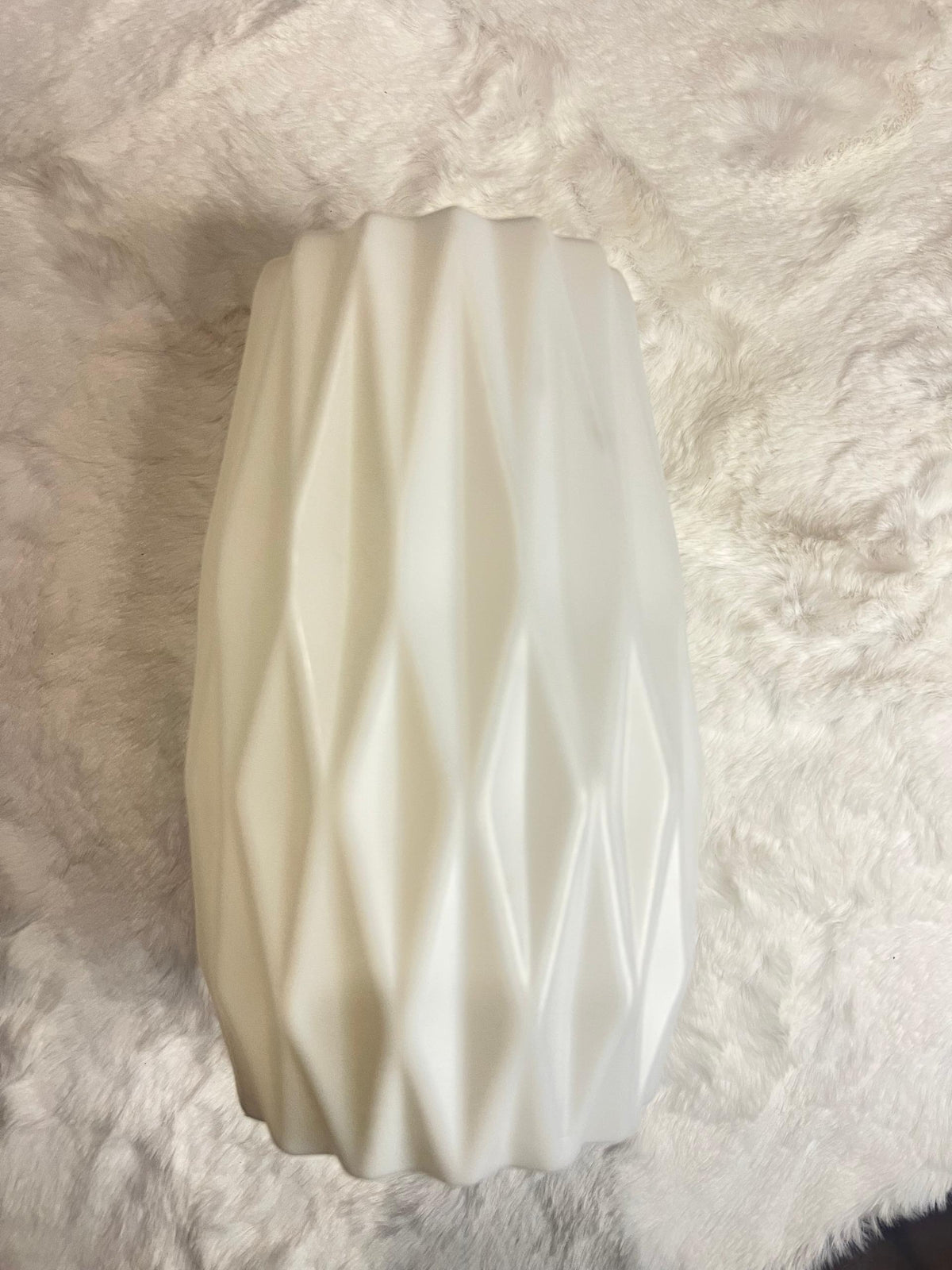 White ceramic vase with a textured, faceted diamond