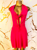 A bright pink sleeveless dress 