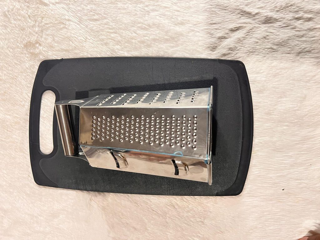 Stainless steel box grater with a dark gray handle