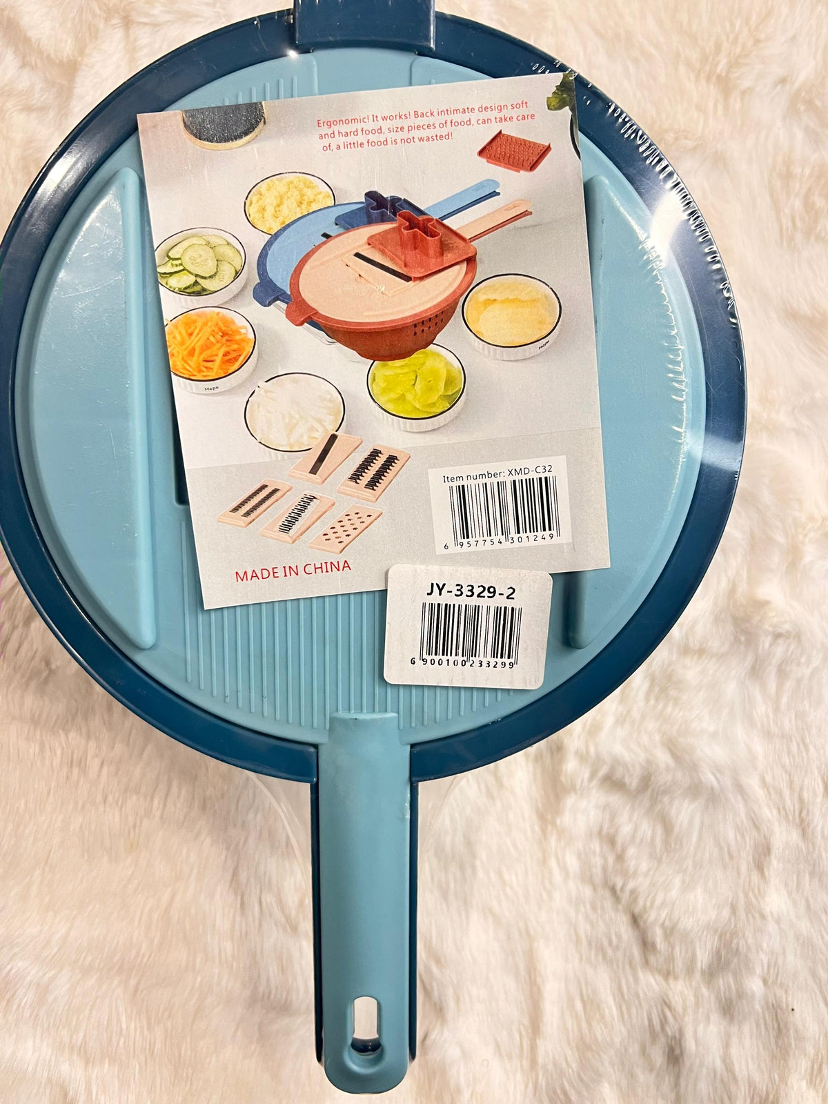 Blue grater with handle and container dish.