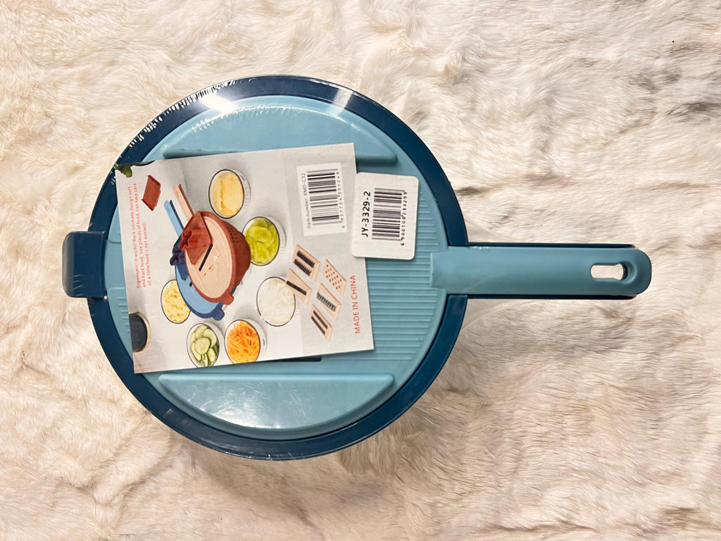 Blue grater with handle and container dish.
