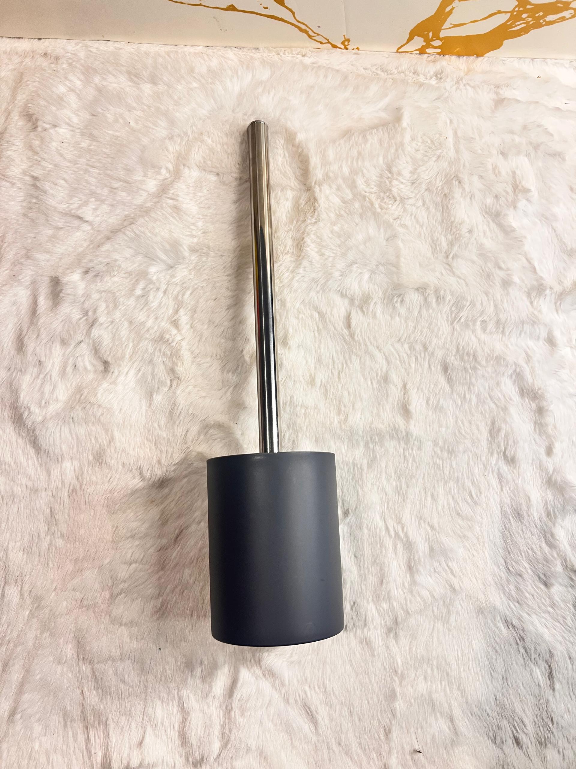 Toilet brush with white bristles and a silver metal handle