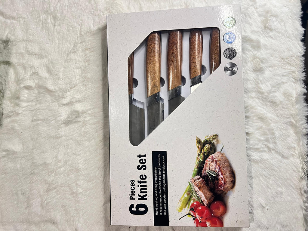 A 6-piece kitchen knife set with wooden handles and a black peeler