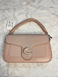 shoulder bag in a dusty pink pebbled leather with a textured flap