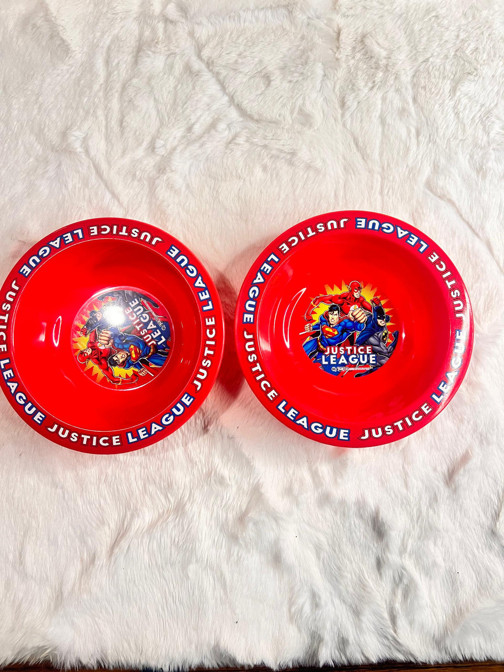 Red plastic kids bowl with 'JUSTICE LEAGUE' printed