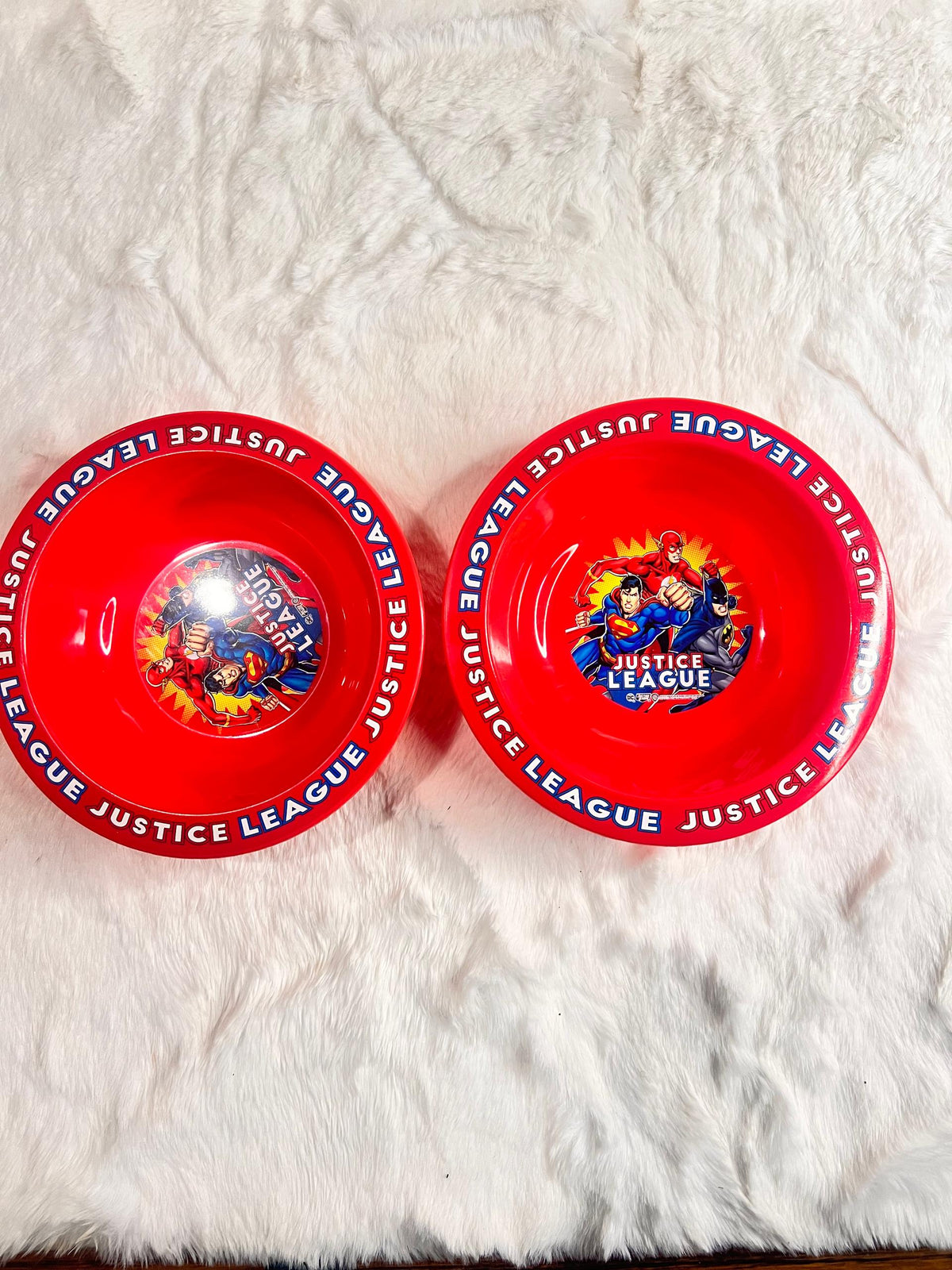 Red plastic kids bowl with 'JUSTICE LEAGUE' printed