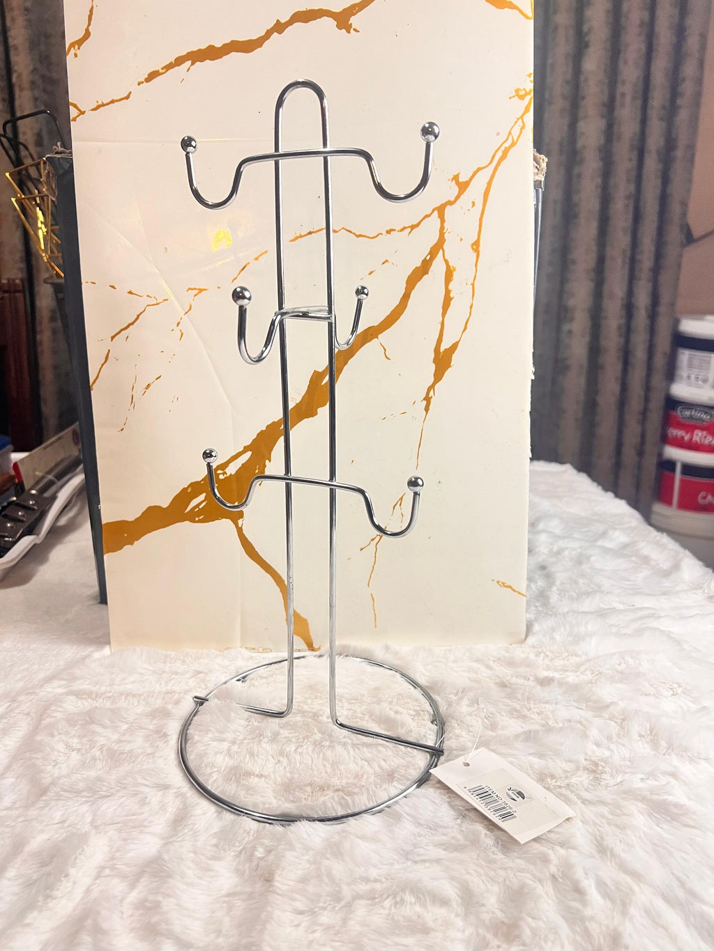 Two silver metal tea cup racks with multiple hooks