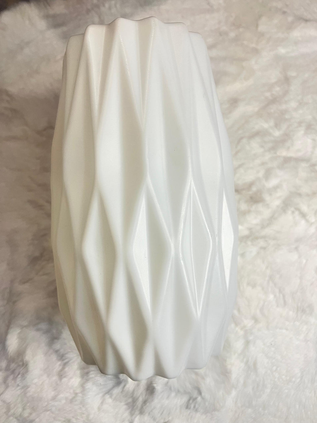 White ceramic vase with a textured, faceted diamond